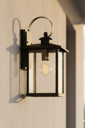 MATT BLACK outdoor wall light with clear glass panels and an E27 60W bulb, mounted on a wall.
