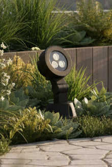 Black outdoor light fixture on grass
